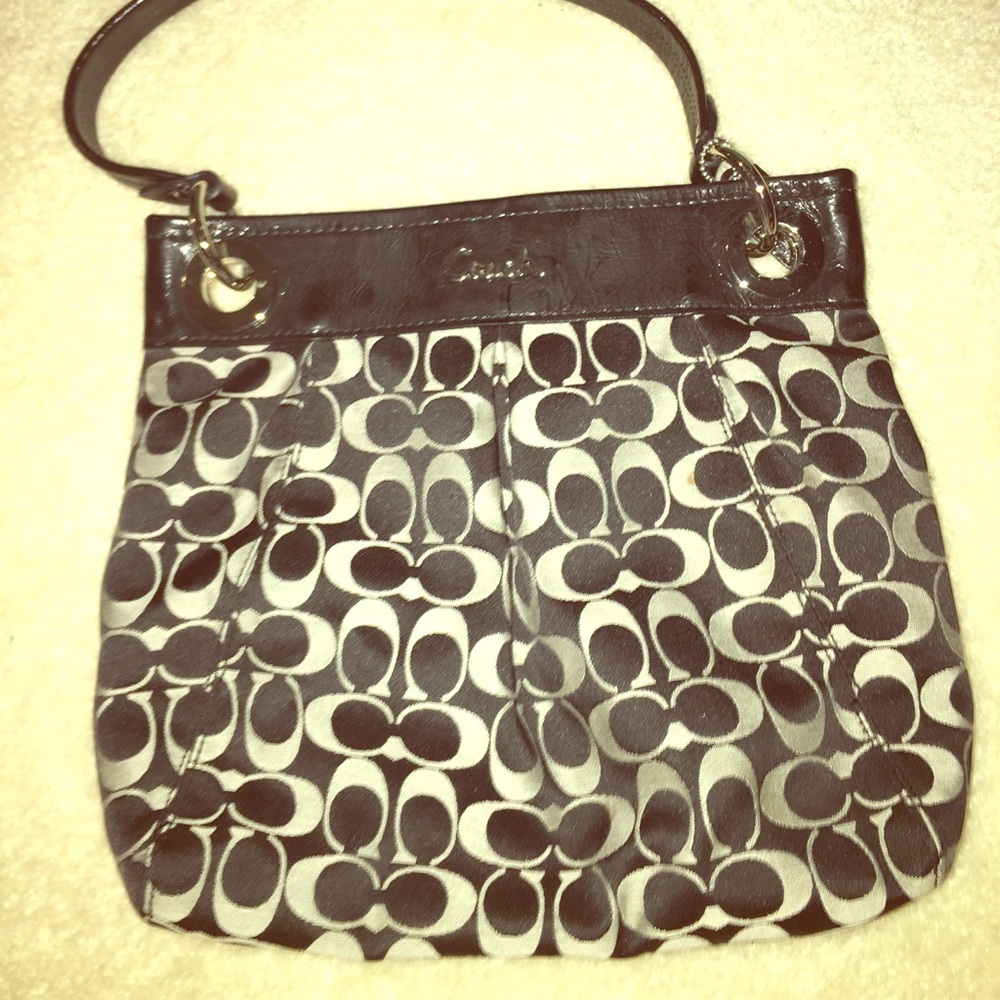 Women’s black and grey coach purse